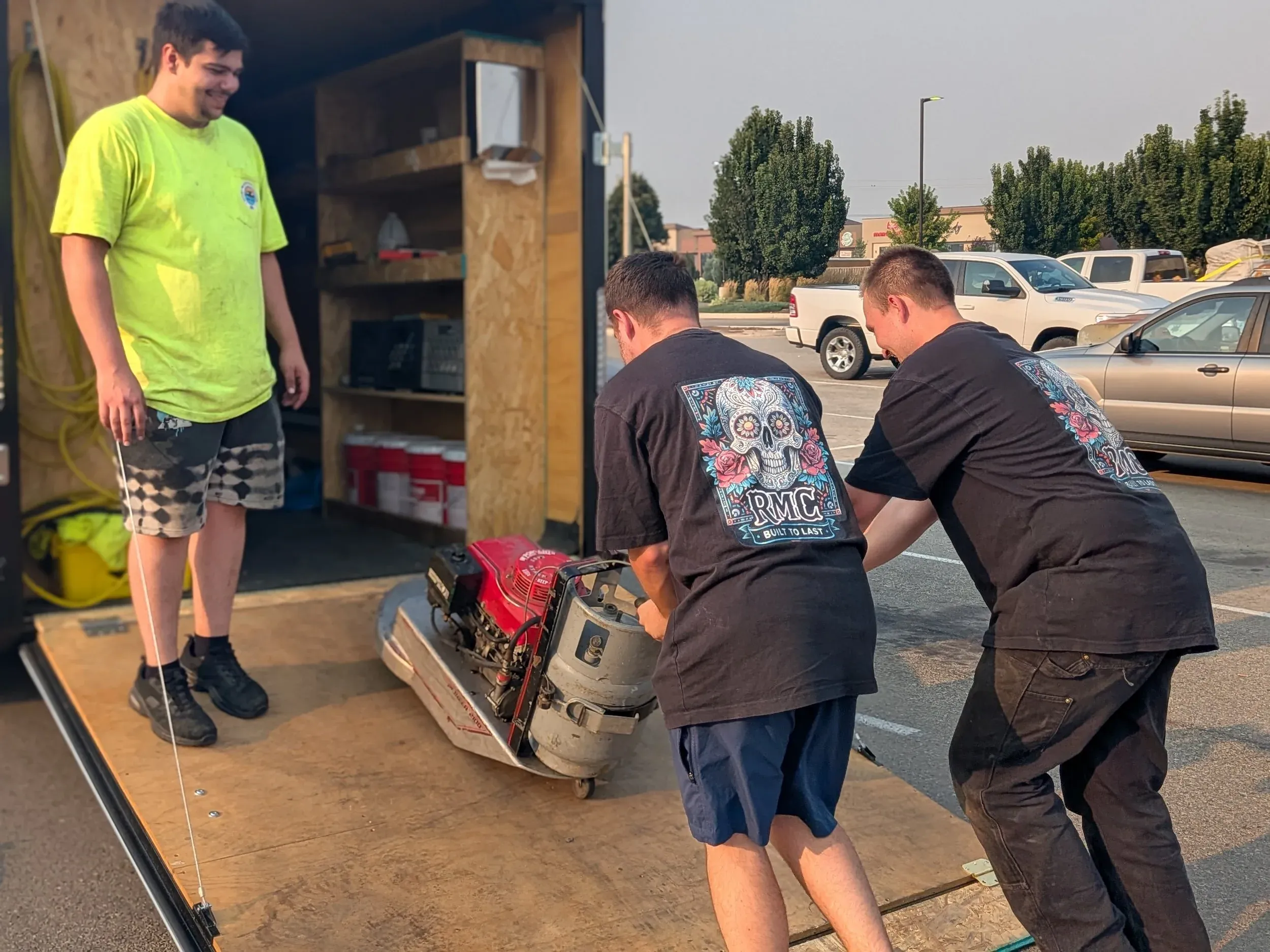 Loading a commercial auto scrubber into the company trailer: Rocky Mountain Cleaning Services owns its own floor equipment.