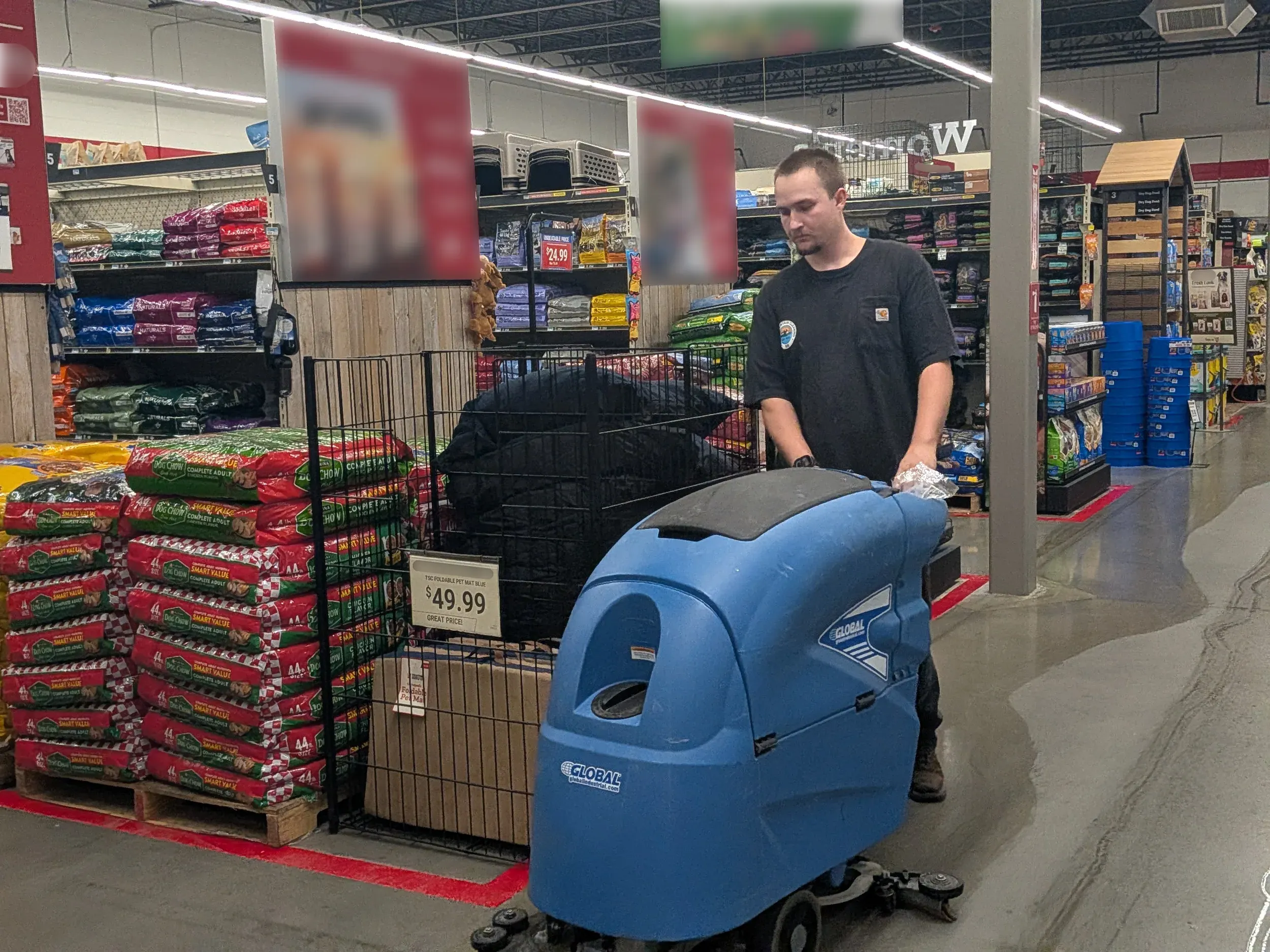 Nick Navarro, owner of Rocky Mountain Cleaning Services, running a floor machine across a store’s concrete aisles.